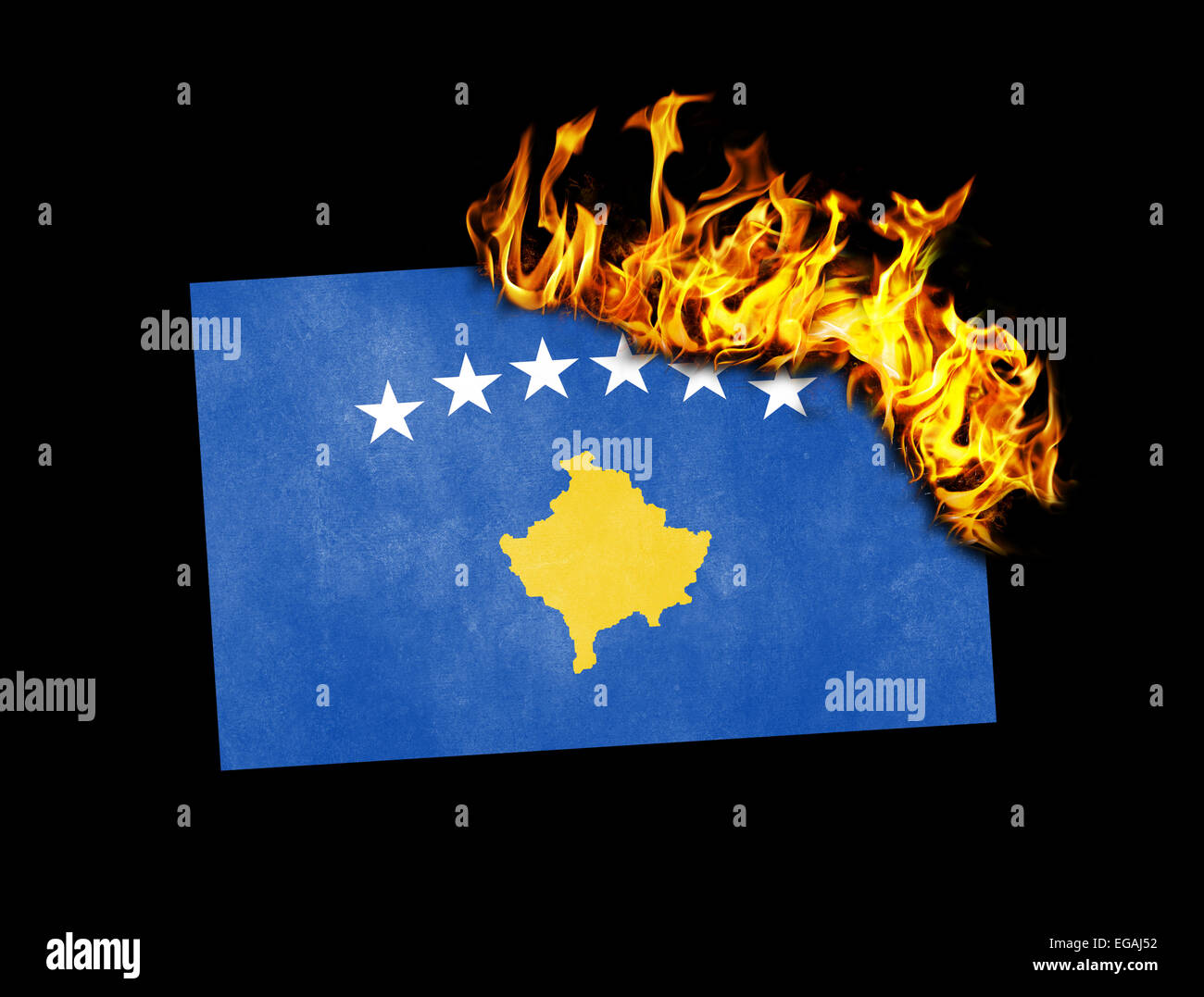 Flag burning - concept of war or crisis - Kosovo Stock Photo