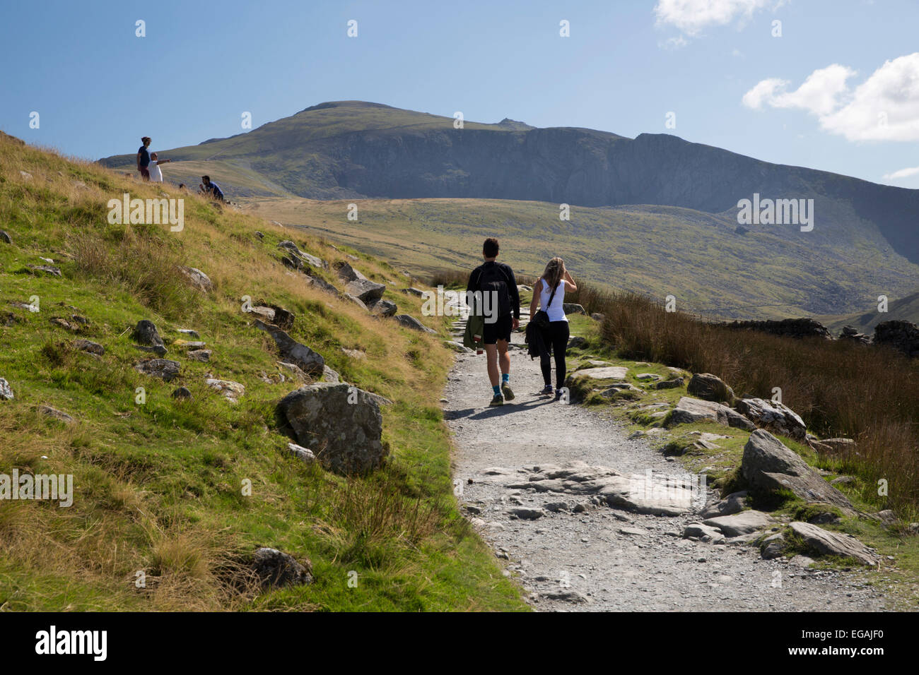 Walkers ascending Snowdon on the Llanberis path, near Llanberis, Snowdonia National Park, Gwynedd, Wales; United Kingdom, Europe Stock Photo