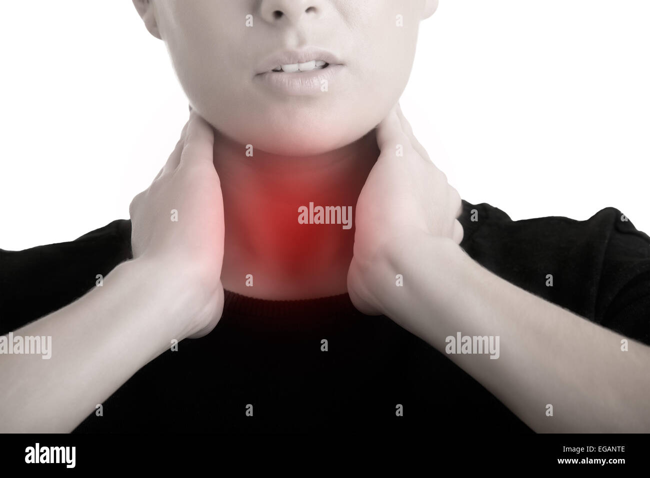 Woman with a sore throat holding her neck Stock Photo