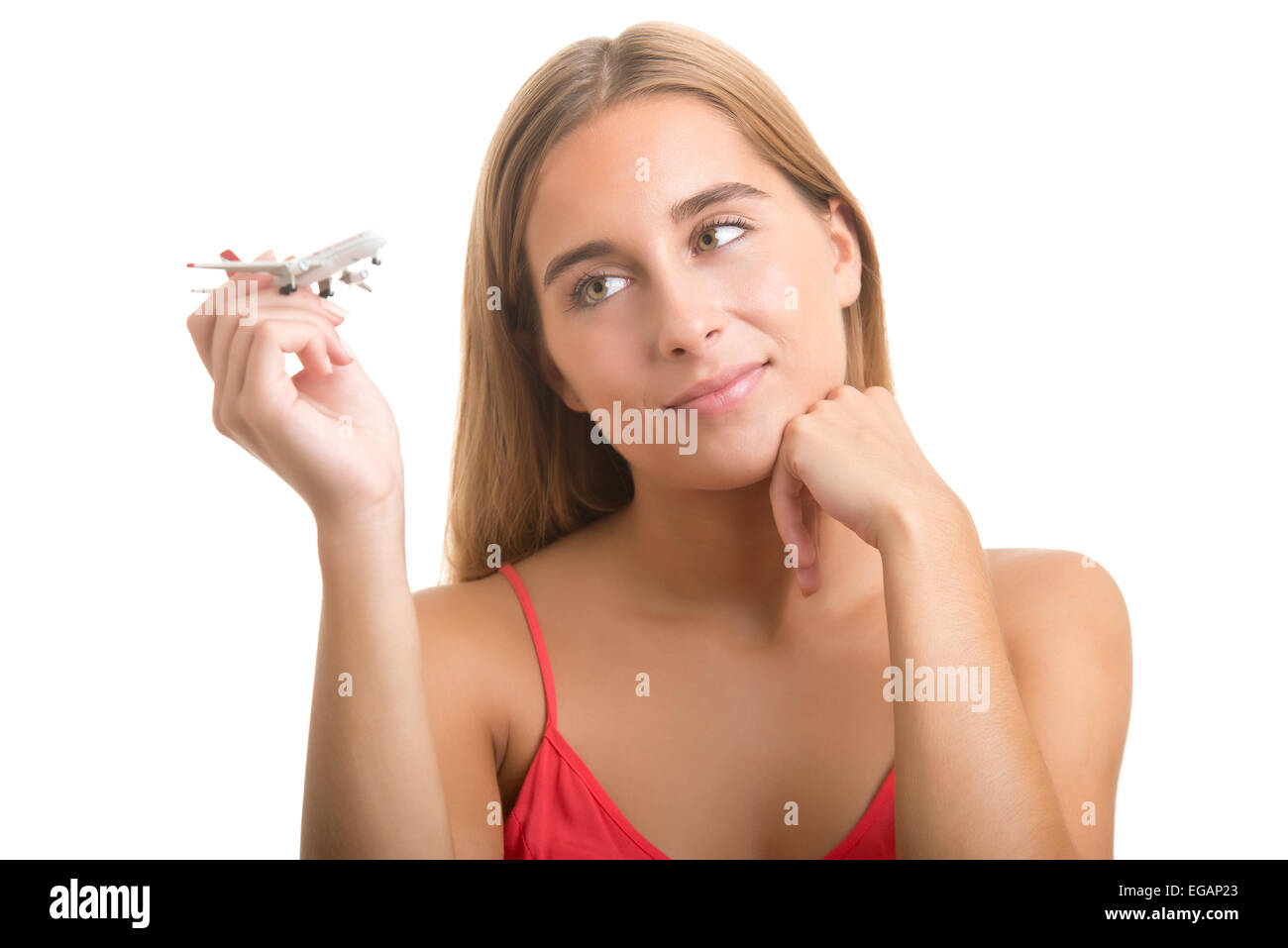 Woman day dreaming about a plane trip isolated in white Stock Photo