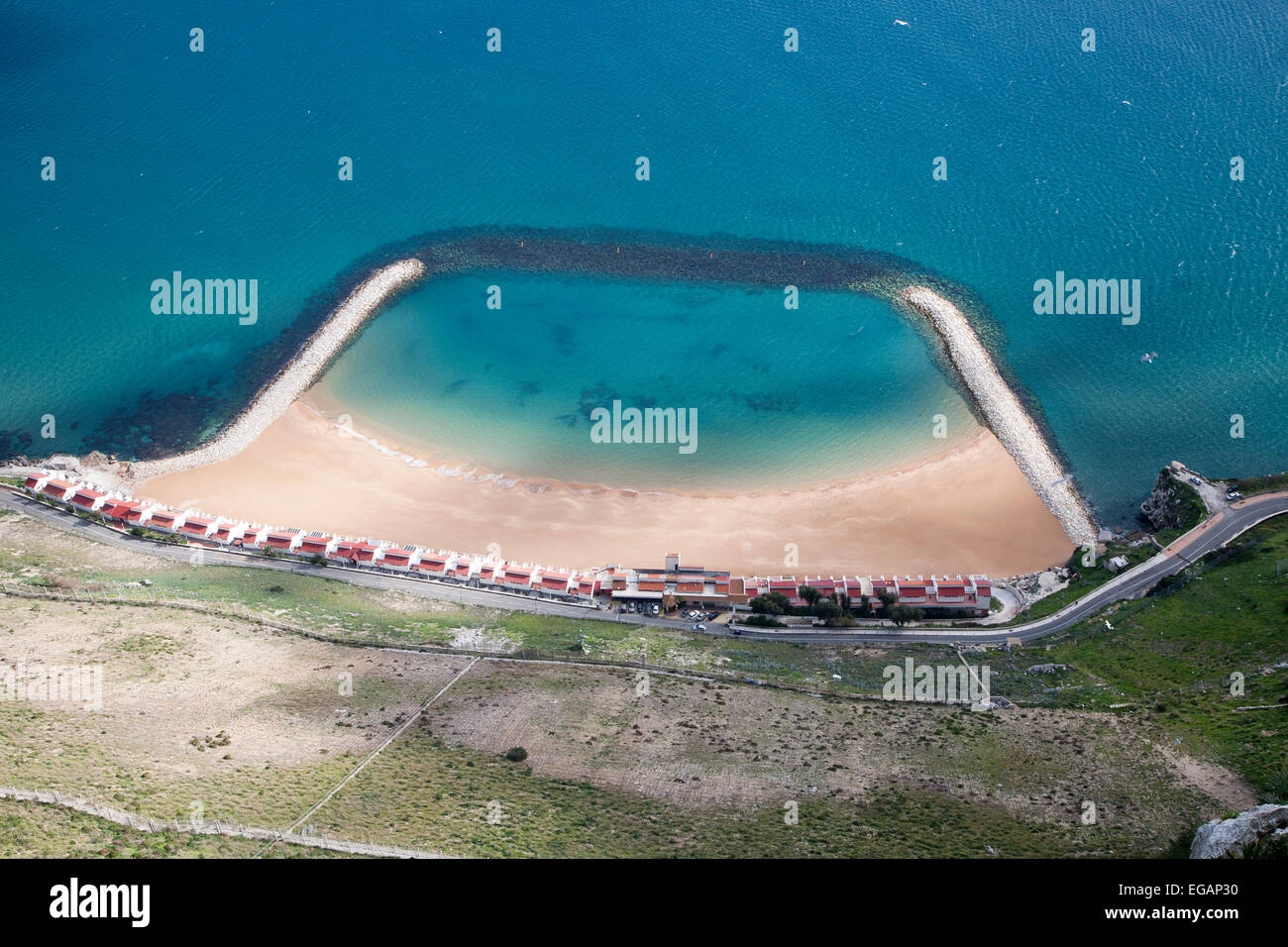 Sandy bay beach created by rock groynes, Gibraltar,  Gibraltar, British territory in southern Europe Stock Photo