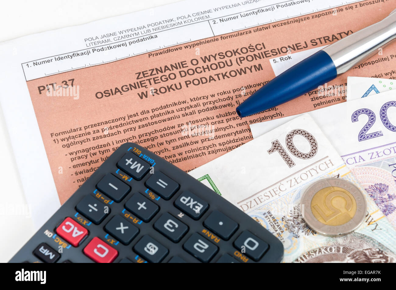 Polish individual tax form PIT37 with money, pen and calculator Stock Photo Alamy