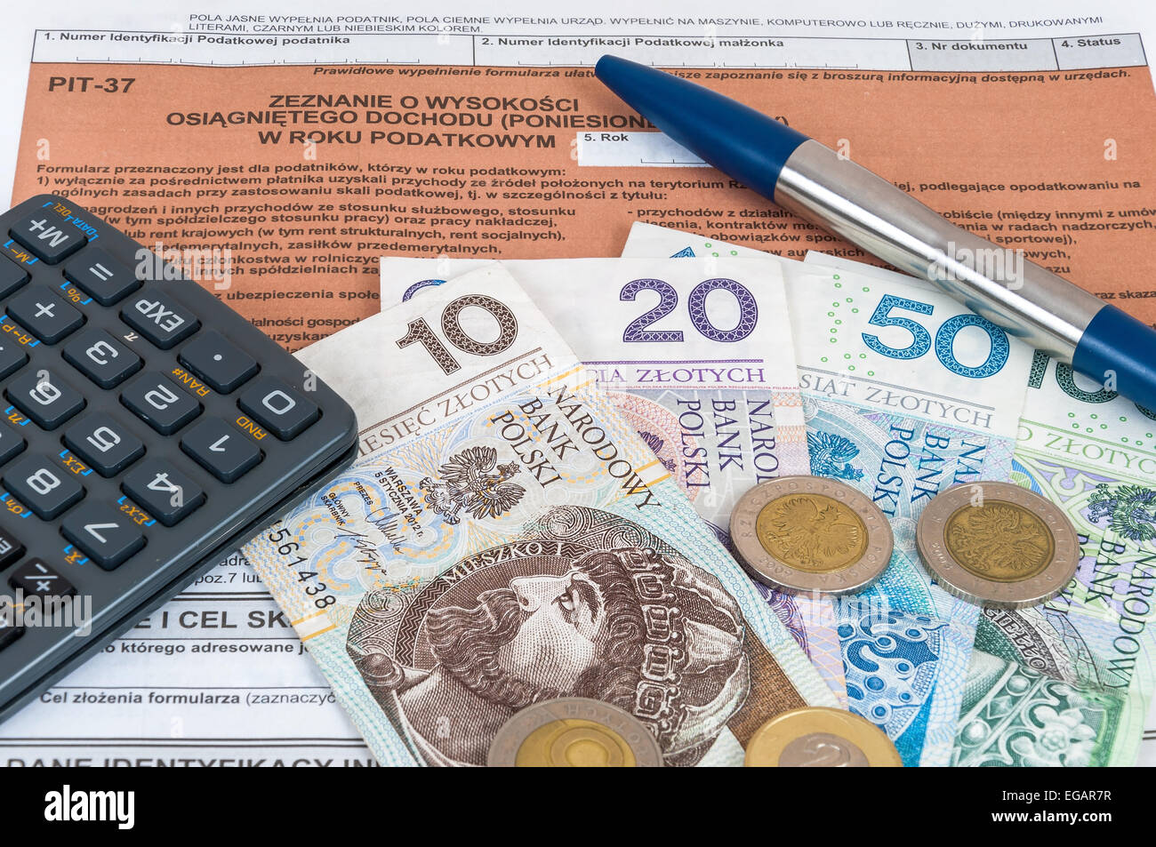 Polish individual tax form PIT37 with money, pen and calculator Stock Photo Alamy