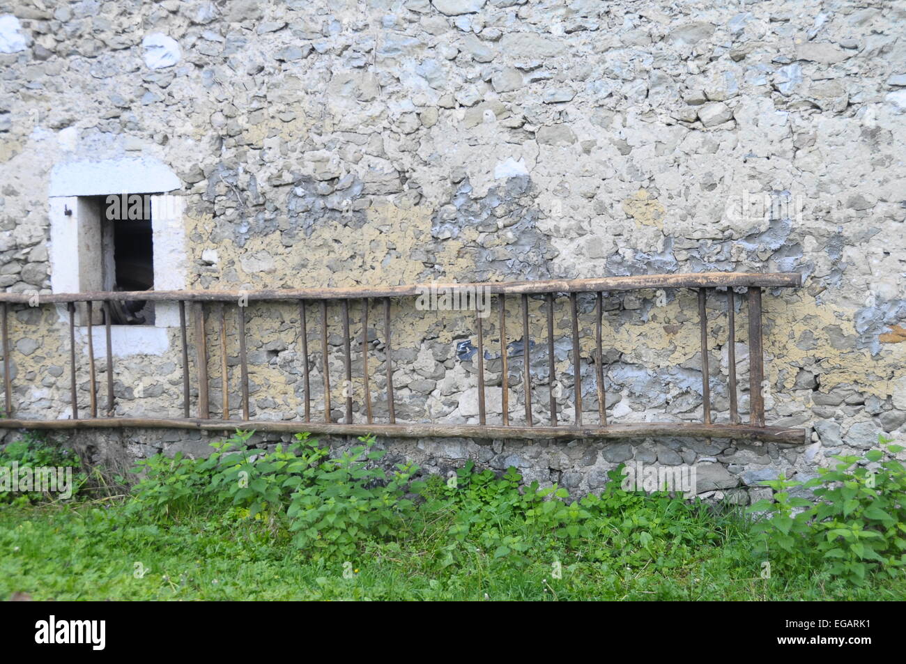 Wooden ladder and rural stone farm wall in France Stock Photo ...