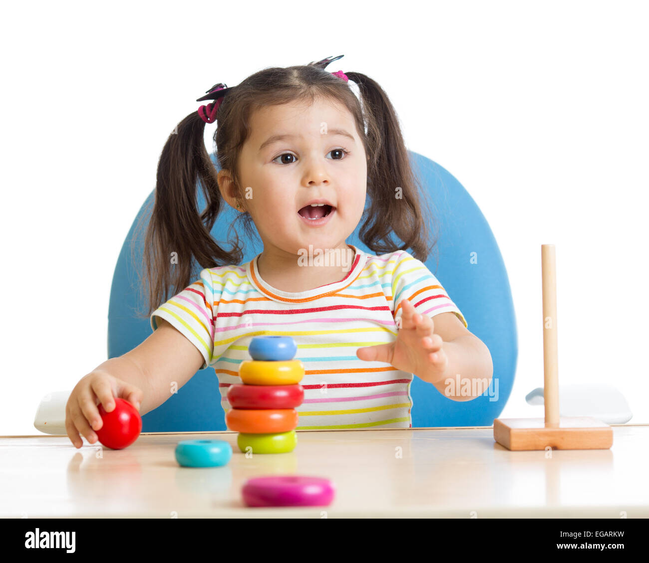 child playing with color pyramid toy Stock Photo