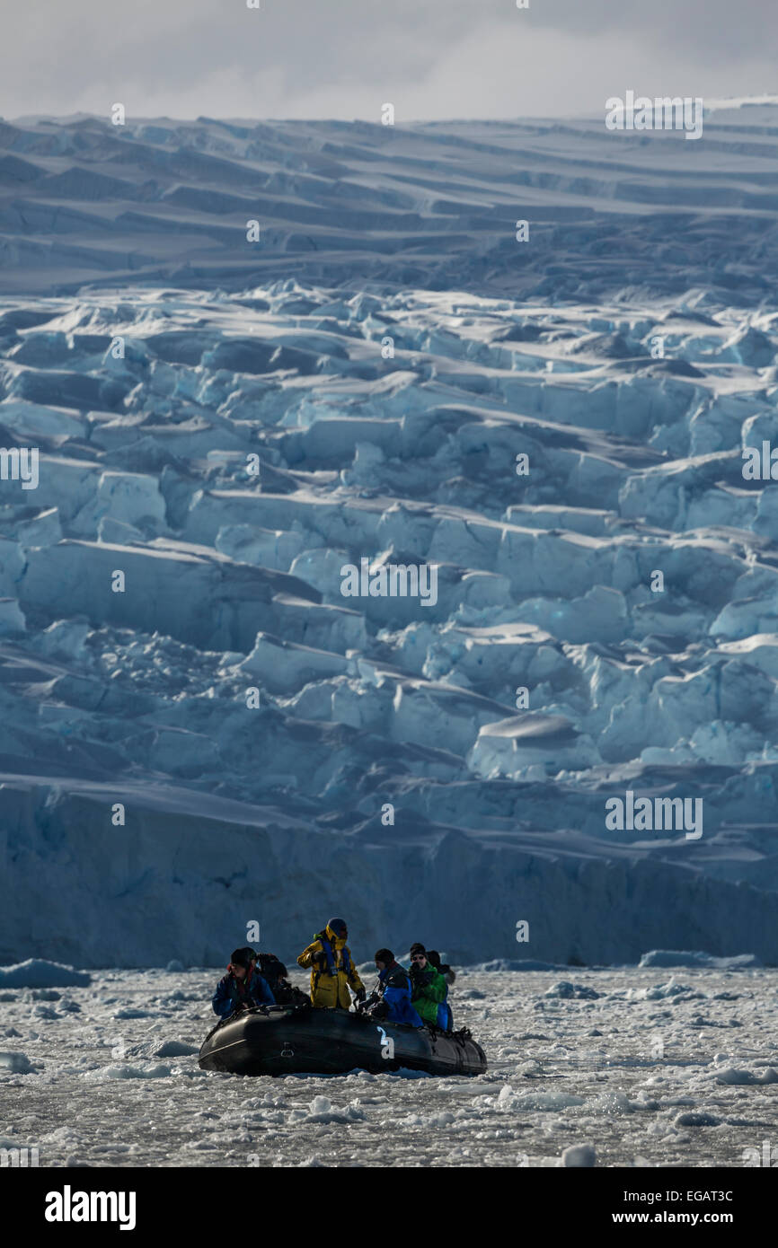 zodiac with photographers photographing glacier, Cierva Cove, Antarctica Stock Photo