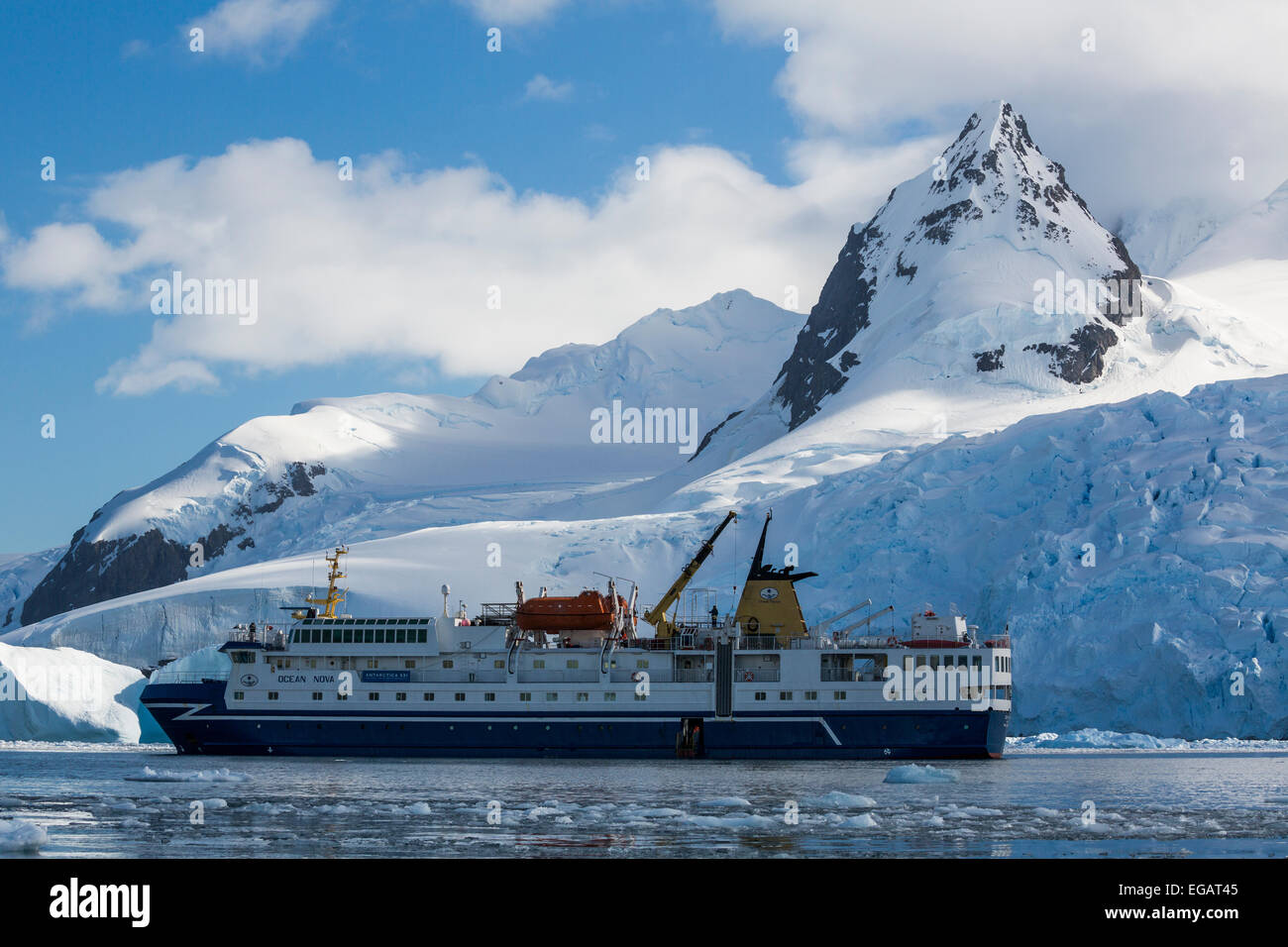 Ocean Nova cruise ship in front of glacier, Cierva Cove, Antarctica Stock Photo
