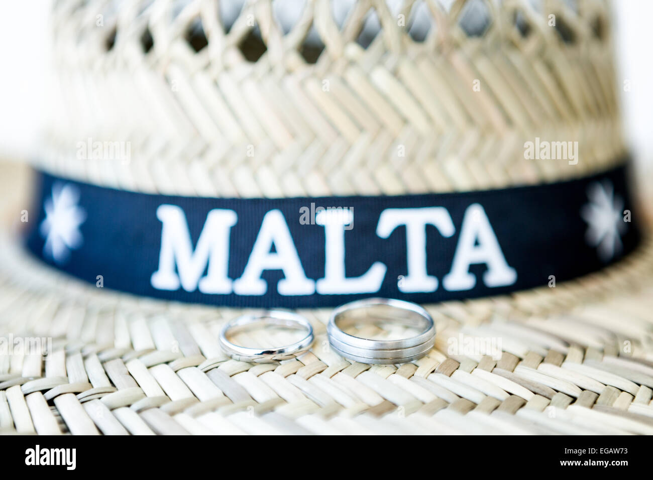 Wedding rings placed on a Maltese straw hat Stock Photo Alamy