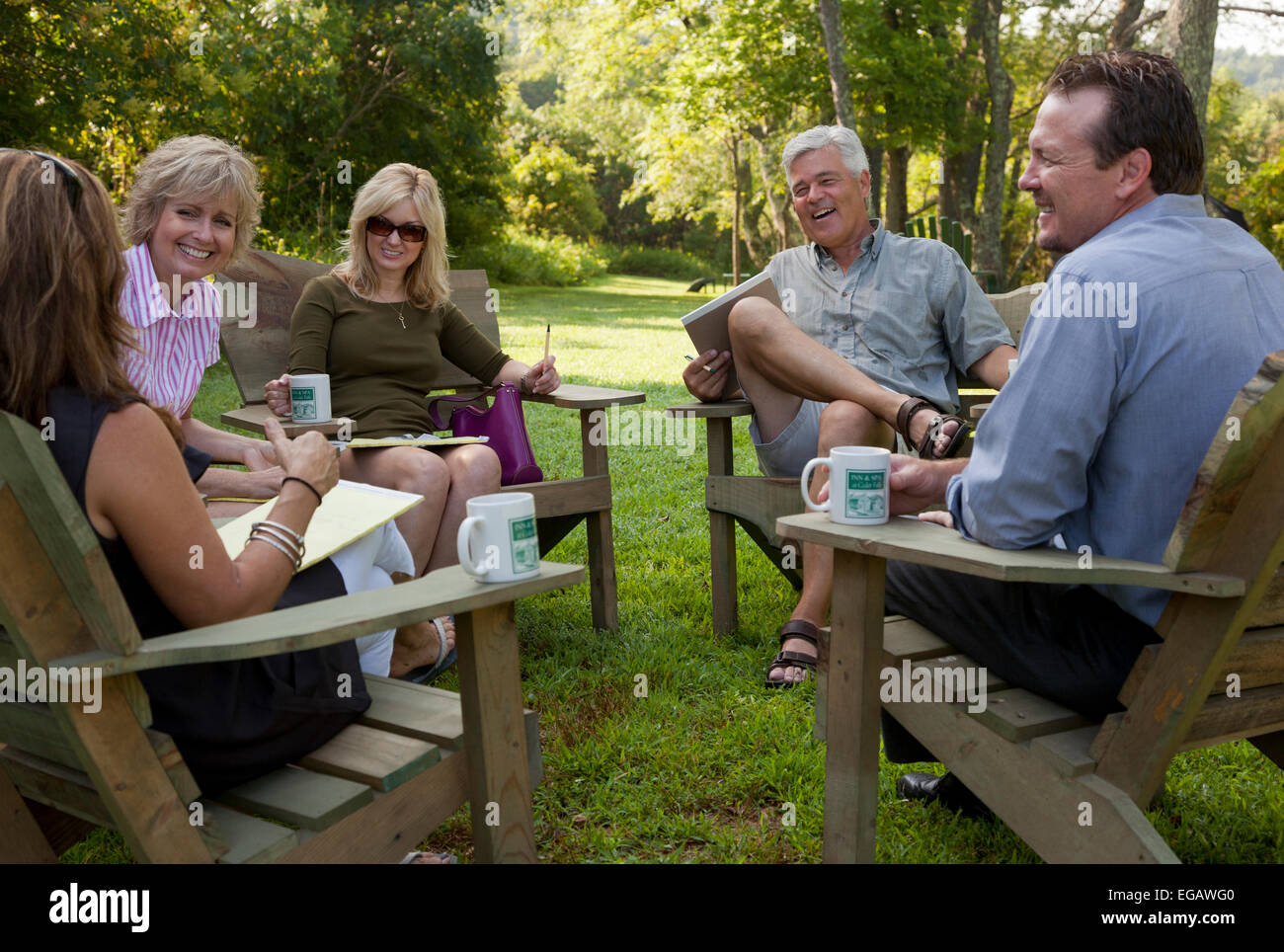 Group of business people meeting outside on corporate retreat Stock Photo