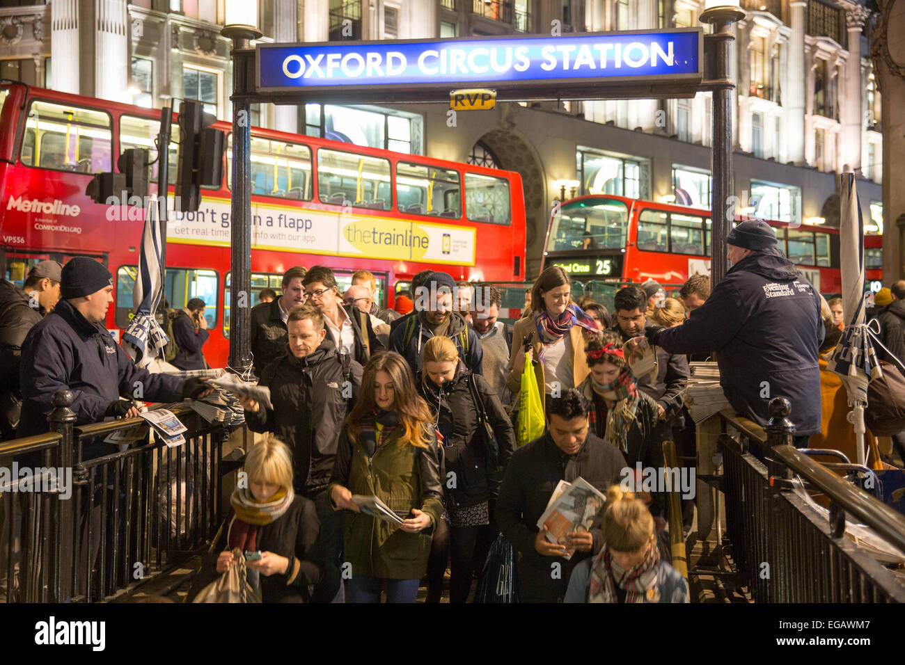 The Evening Standard is distributed as commuters decend into the Underground at Oxford Street station Stock Photo