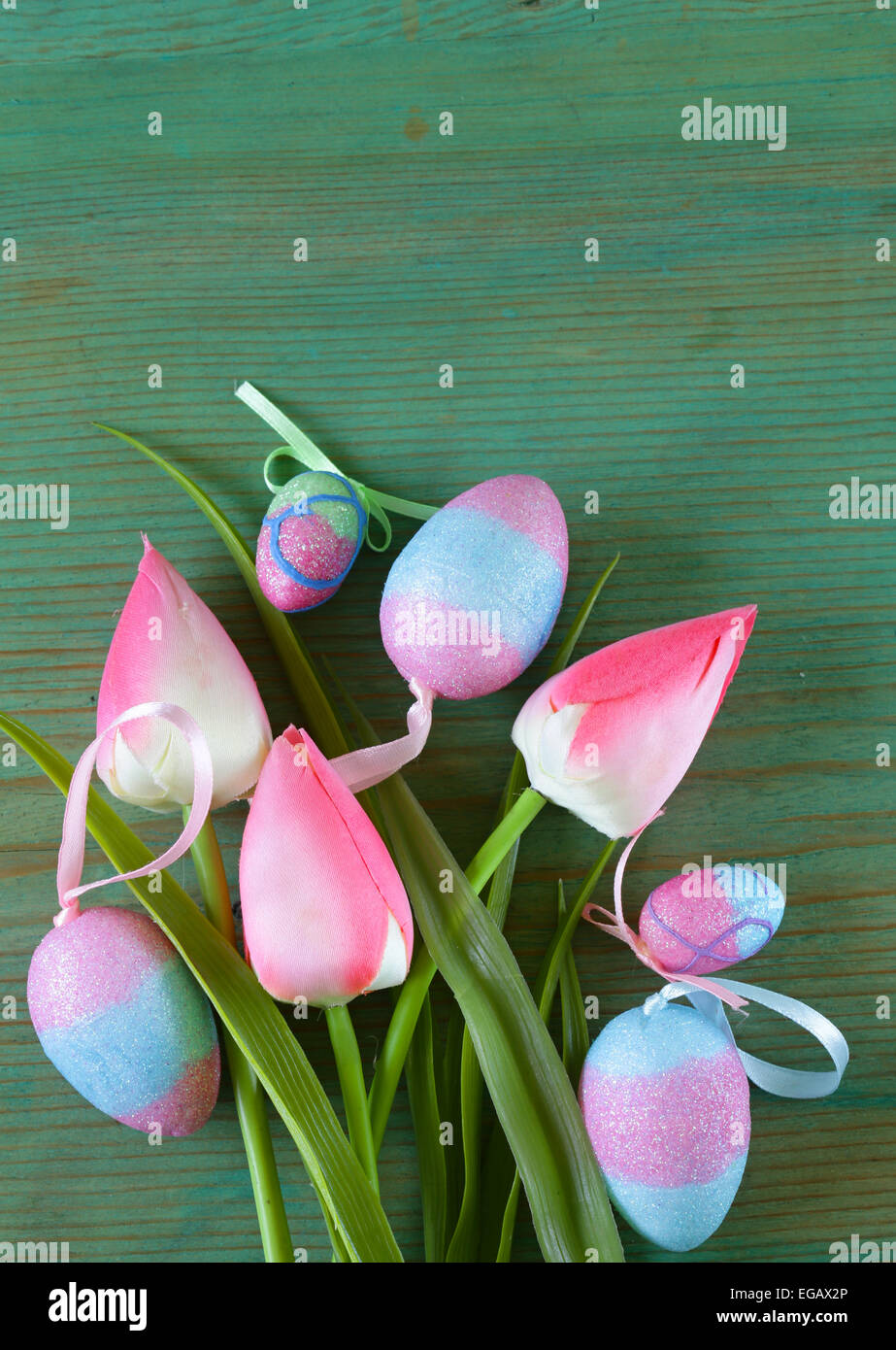 Colorful decorative easter eggs and branch with spring flowers on the ...