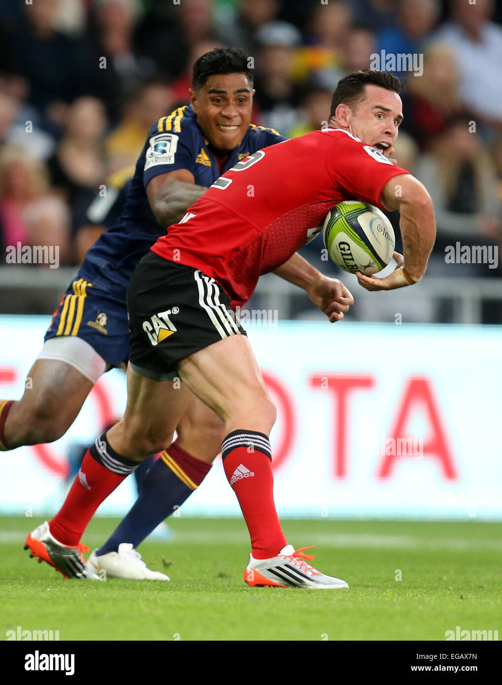 Dunedin, New Zealand. 21st Feb, 2015. Ryan Crotty of the Crusaders, right, in the tackle of Malakai Fekitoa of the Highlanders during the Super 15 rugby match between the Highlanders and the Crusaders at Forsyth Barr Stadium, Dunedin, Saturday, February 21, 2015. Credit:  Action Plus Sports/Alamy Live News Stock Photo