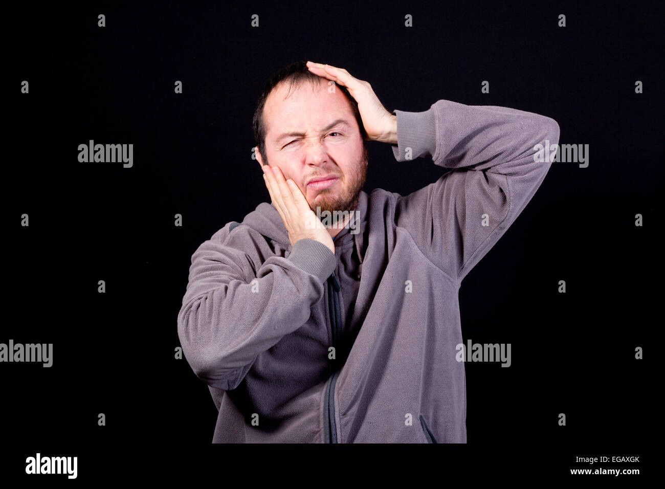 man with toothache isolated on black Stock Photo