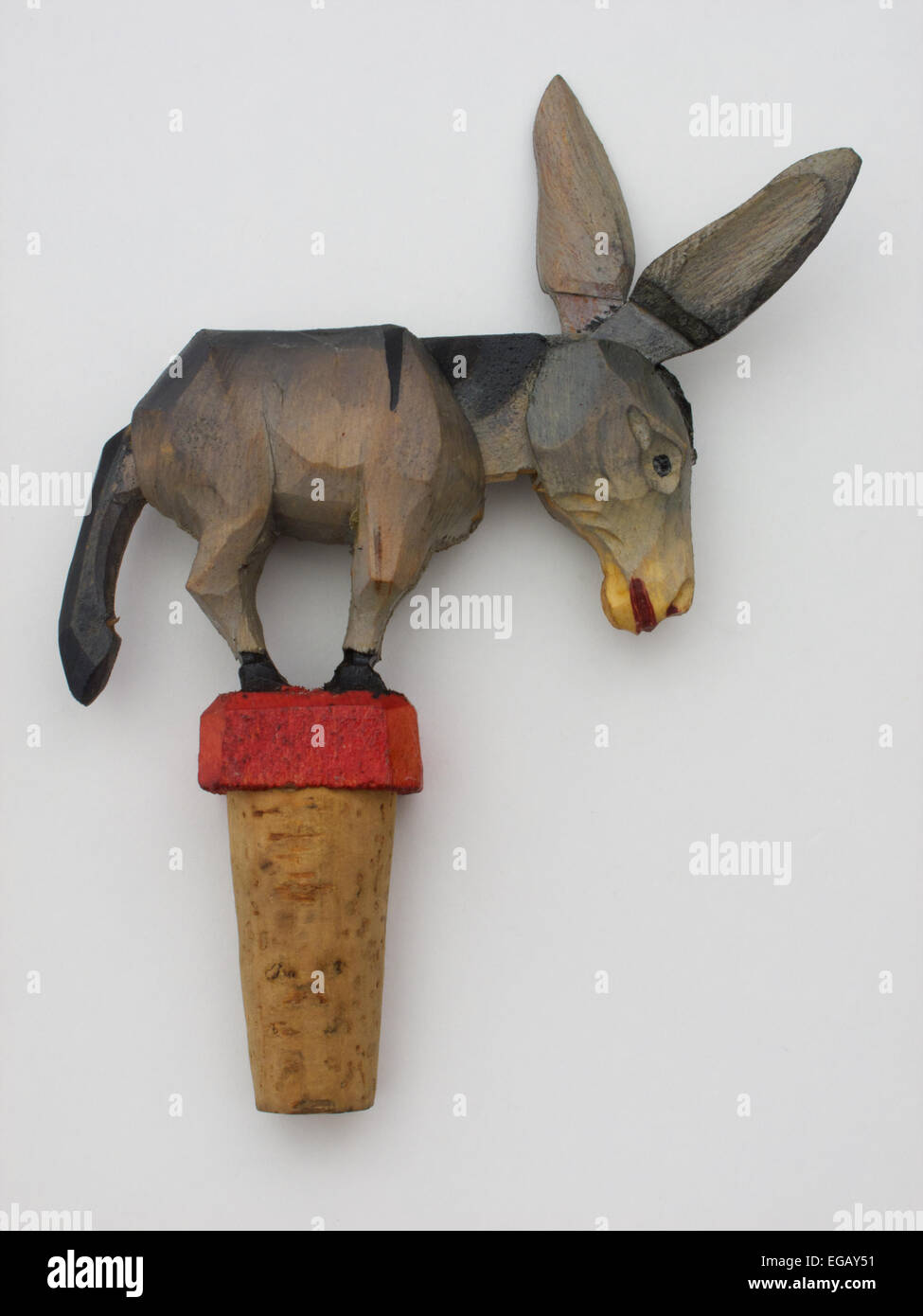 Amusing vintage Arni hand carved articulated bottle stopper in the form of a donkey. When the donkey’s tail is lifted the head r Stock Photo