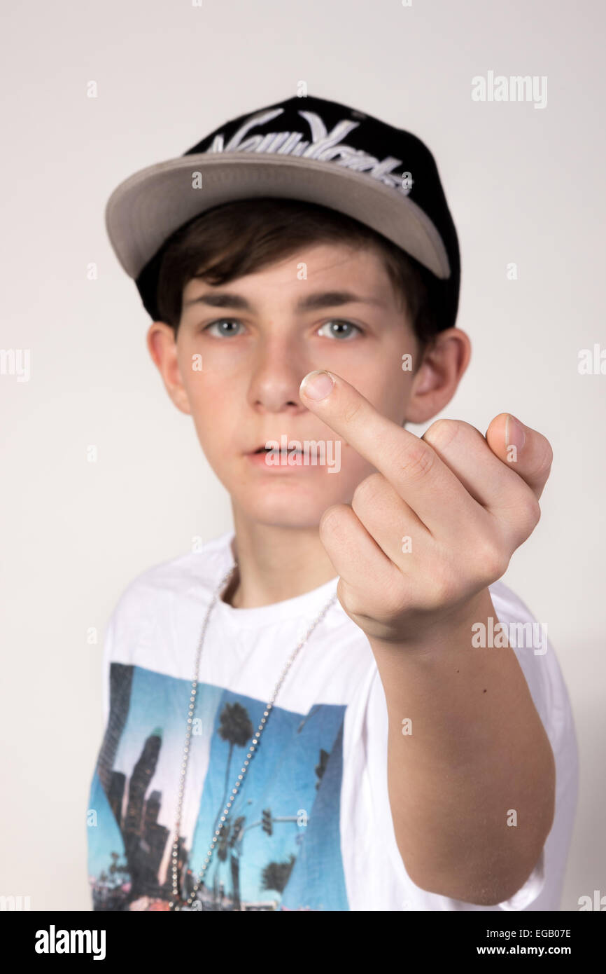 White teenage boy giving the middle finger Stock Photo