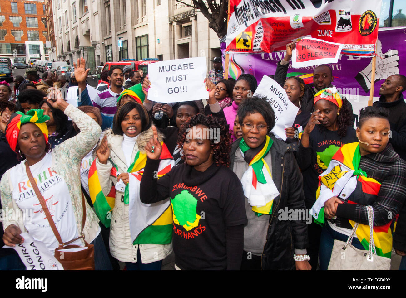 London, UK. 21st February, 2015. Dozens of exiled Zimbabweans gather outside their embassy in London proclaiming Mugabe's last birthday in office. Singing and dancing as they have done every Saturday since 2002, the group spoke with passersby and added yet more names to their petition. PICTURED: Credit:  Paul Davey/Alamy Live News Stock Photo