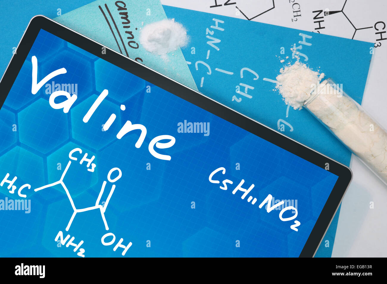 Tablet with the chemical formula of  Valine. Amino acids. Stock Photo