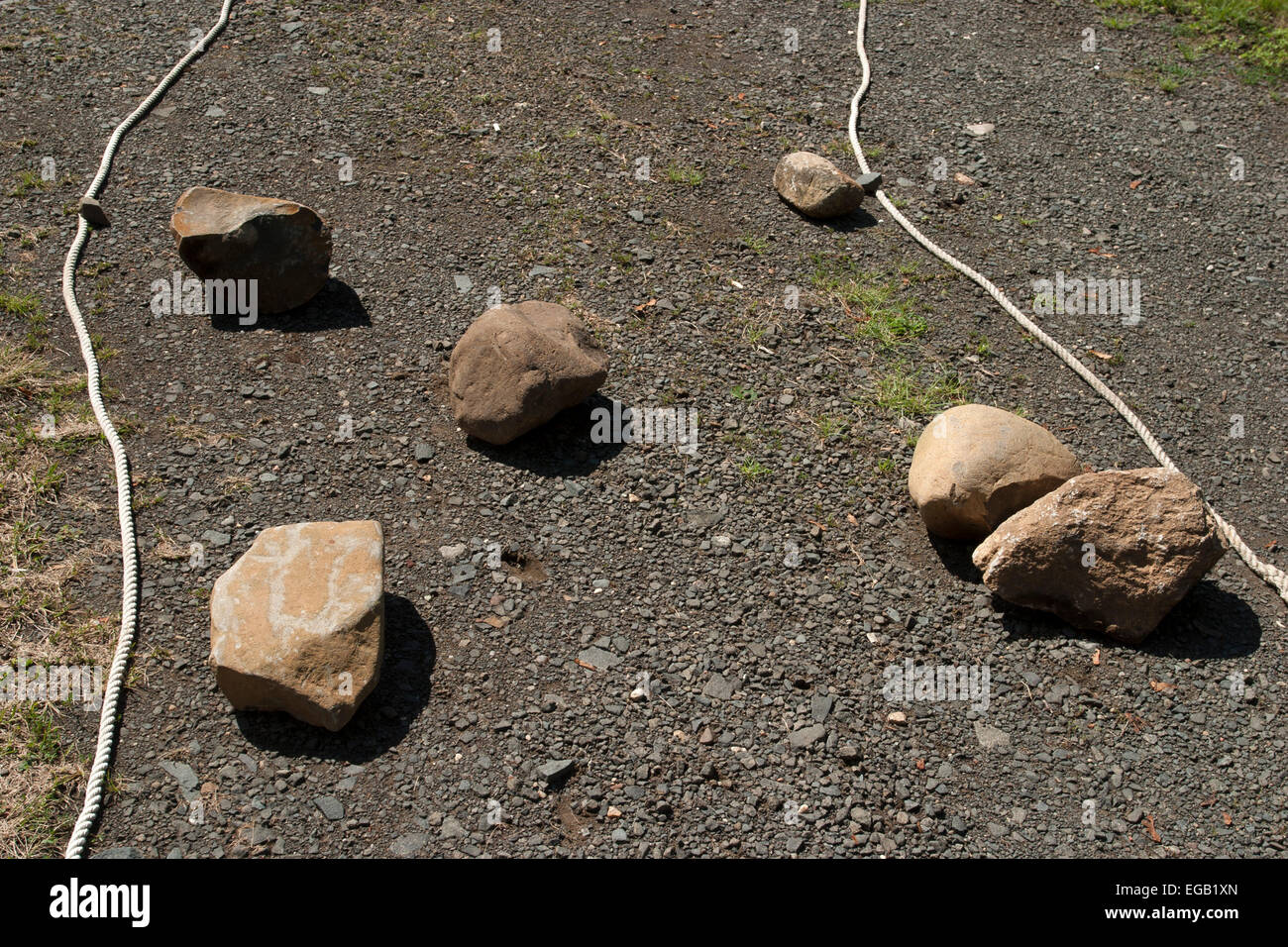 Rocks and rope make a design on the ground Stock Photo - Alamy