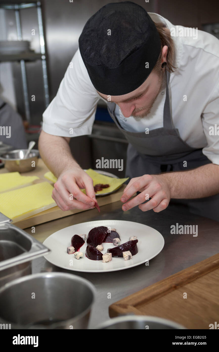 Chef in Kitchen preparing Cheese and Beetroot StarterDish at Sixty One Restaurant in London Stock Photo
