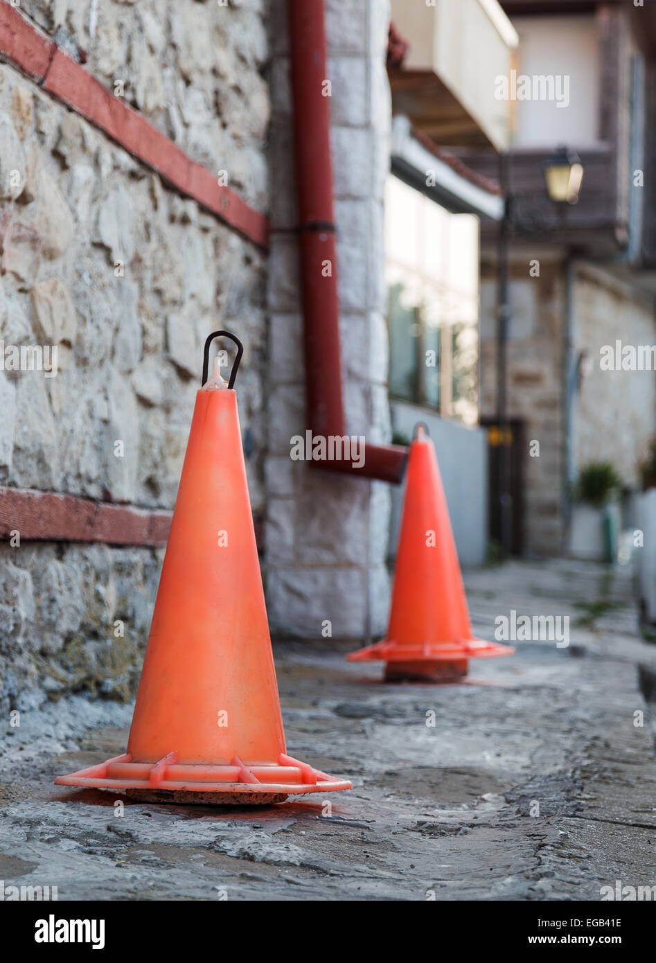 traffic cone stone wall background Stock Photo - Alamy