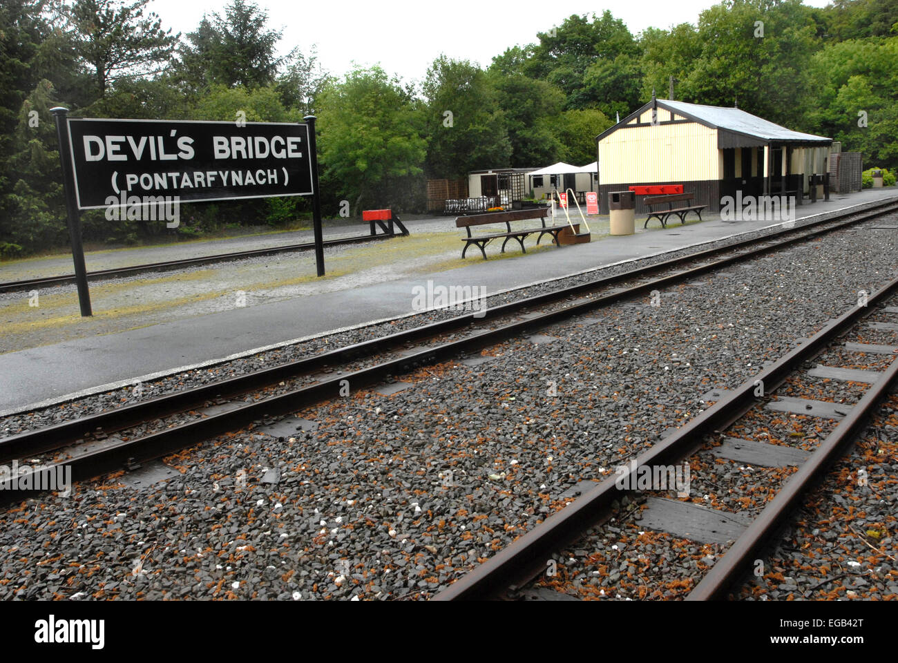 Devil's Bridge station with the sign in Welsh and English. The narrow track railway  runs from Aberystwyth to this terminus. Stock Photo
