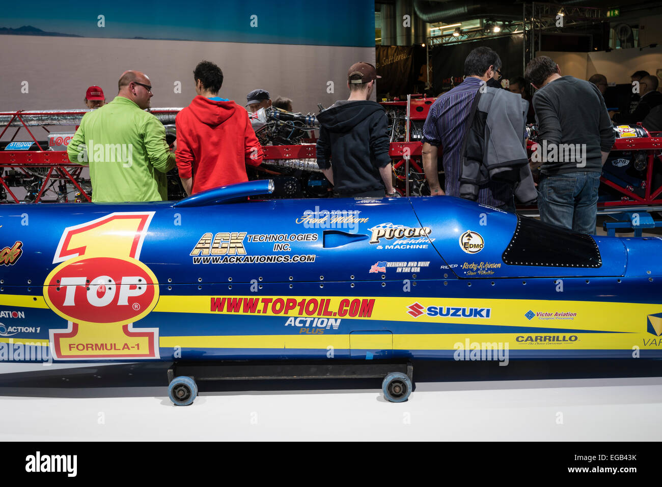 Zurich, Switzerland. 20th February, 2015. Visitors of Switzerland's largest motorcycle show 'Swiss-Moto' in Zurich gather around 'Ack Attack', the world's fastest motorcycle (fairing in the front, chassis in the back). The streamliner motorcycle is powered by two Suzuki Hayabusa engines, has more than 1000hp and reached 605.7 km/hour (376.4 mph) at Bonneville - current world record. Credit:  thamerpic/Alamy Live News Stock Photo