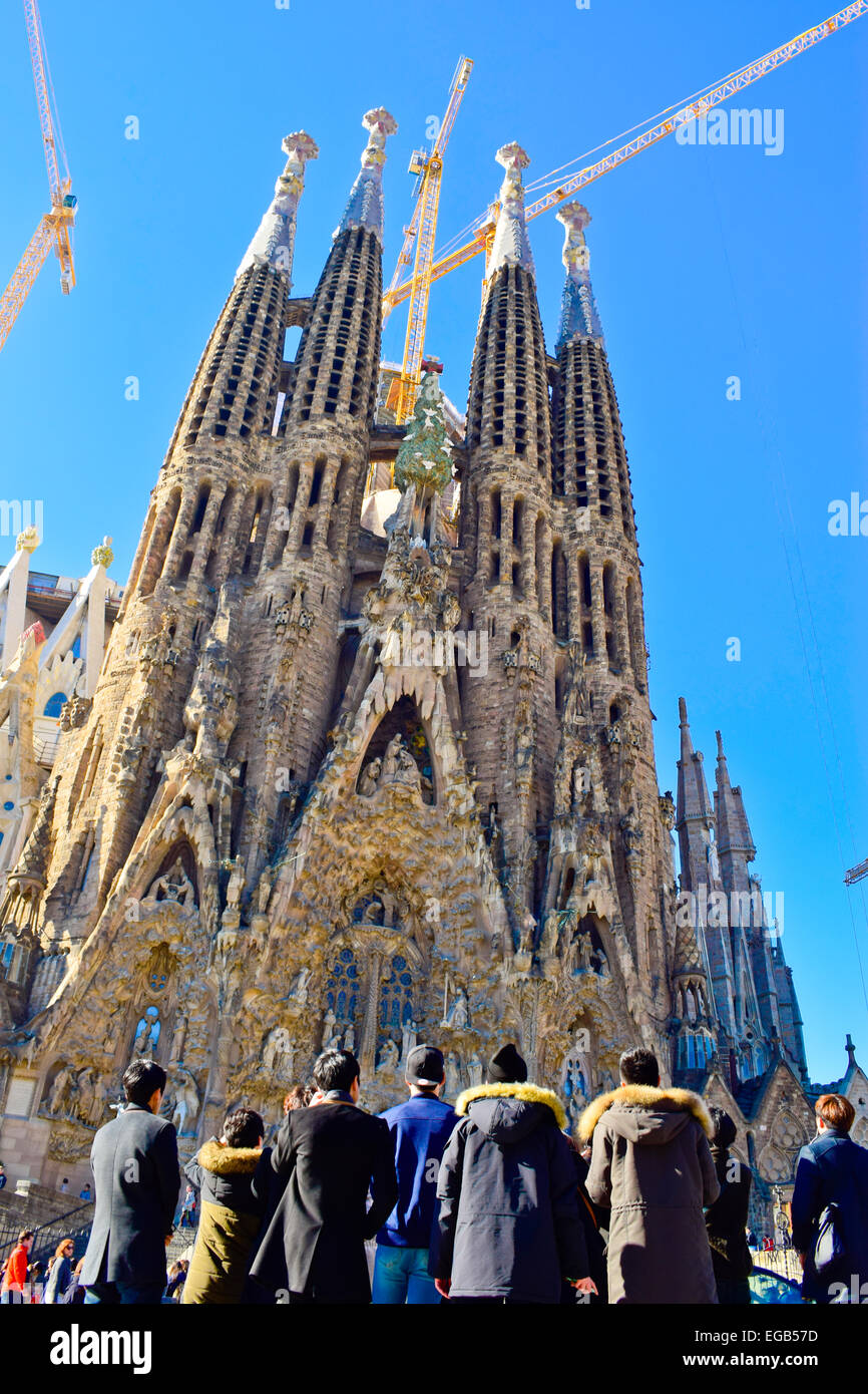 Tourists near la Sagrada Familia designed by Antoni Gaudi architect. Barcelona, Catalonia, Spain. Stock Photo
