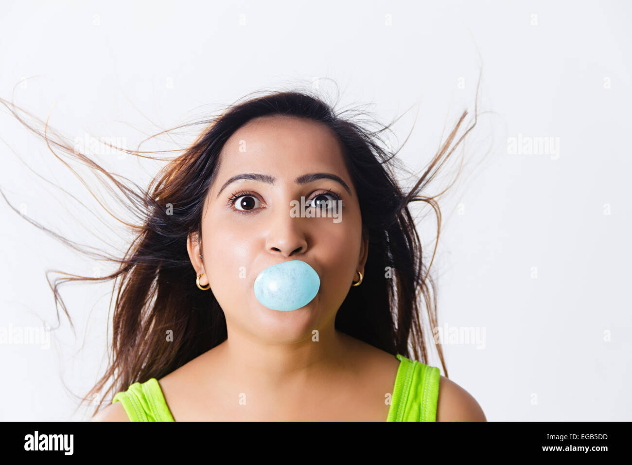 1 indian Girl Blowing  Bubble Gum Stock Photo