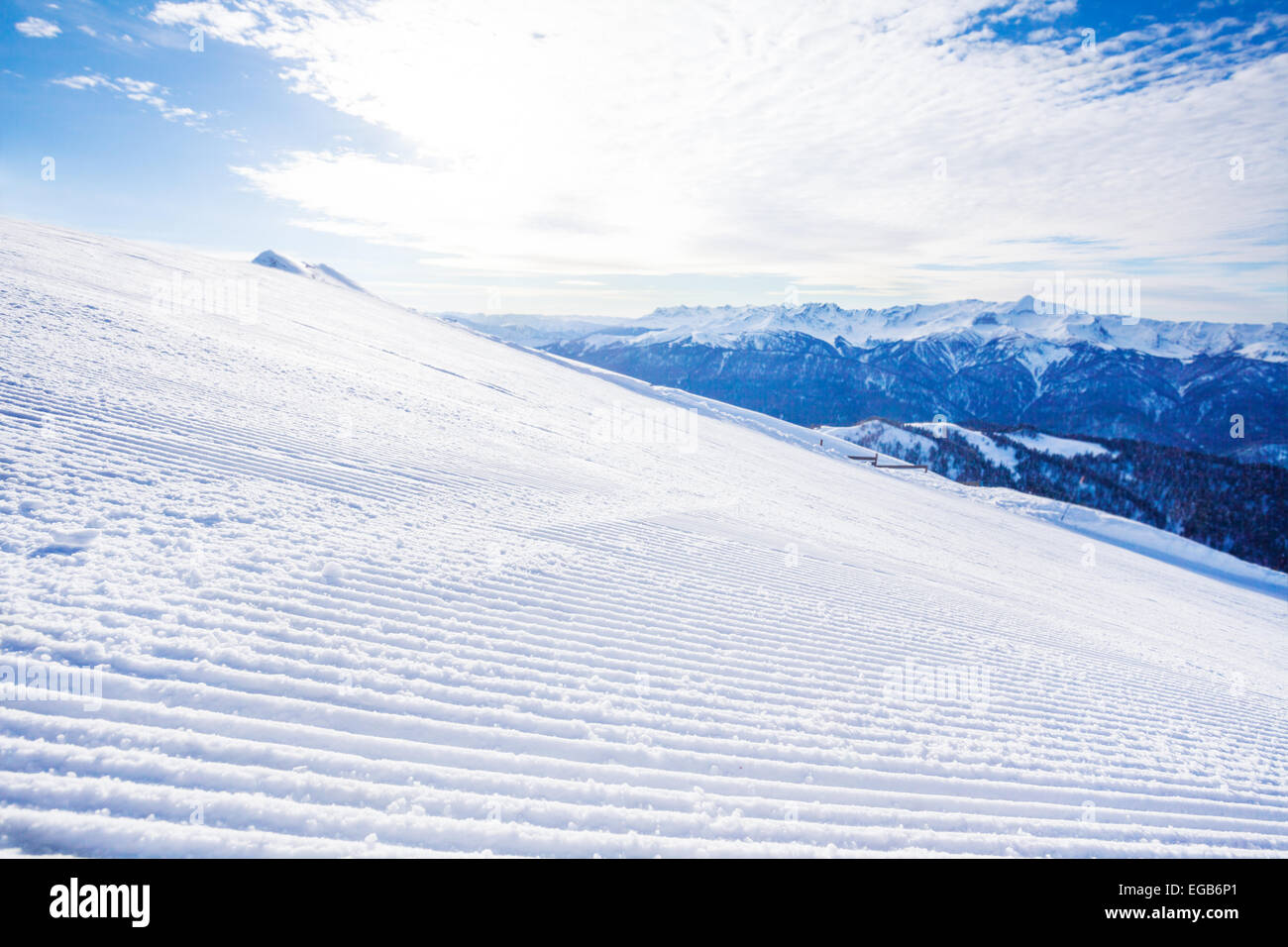 Winter landscape of ski-track and Caucasus hills Stock Photo