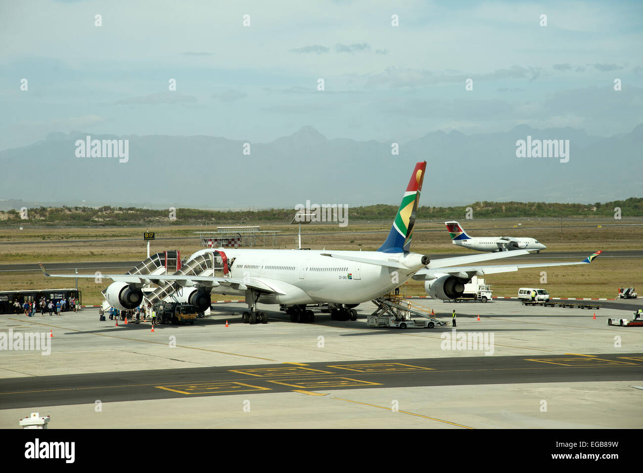 Passengers boarding a South African A340 jet on the apron Cape Town
