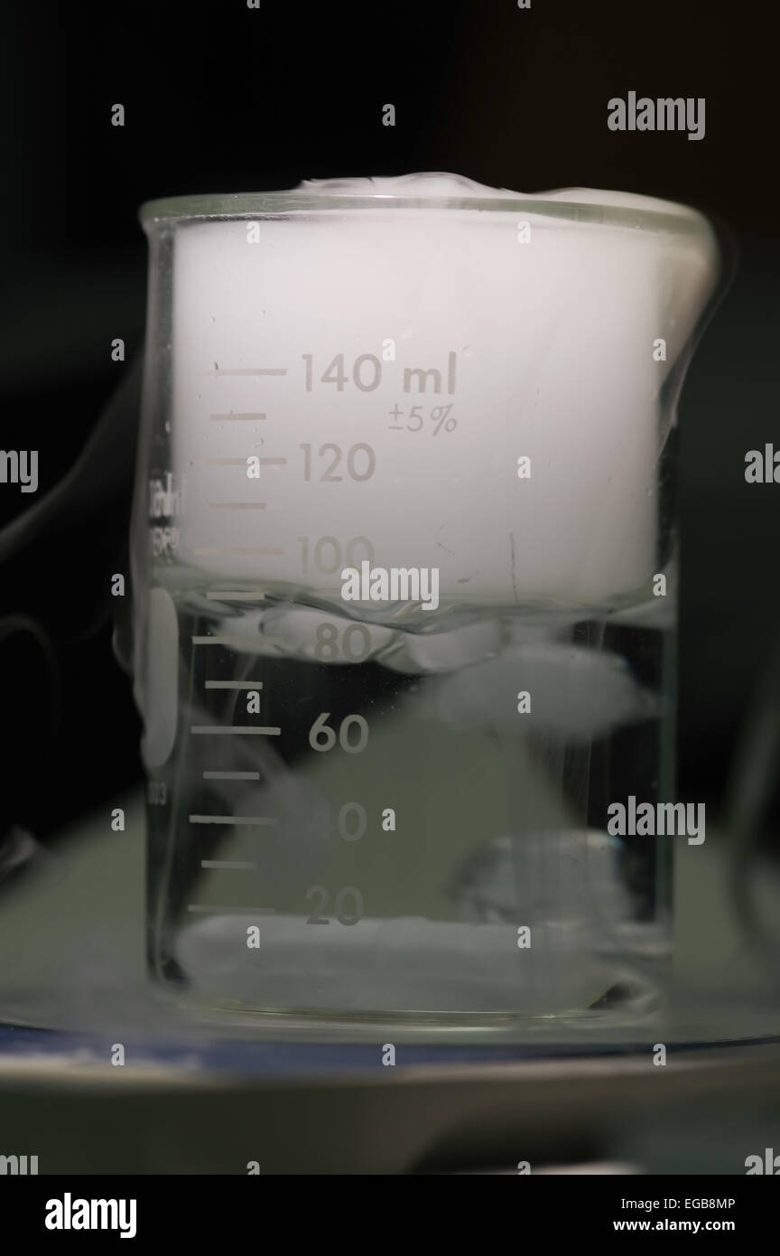 Dry ice reacting with the water placed in laboratory glassware Stock Photo Alamy