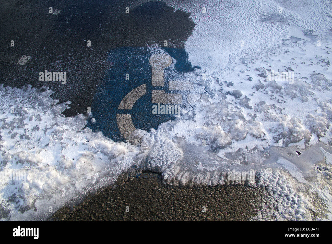 Handicap only parking symbol on snowy parking space. Stock Photo