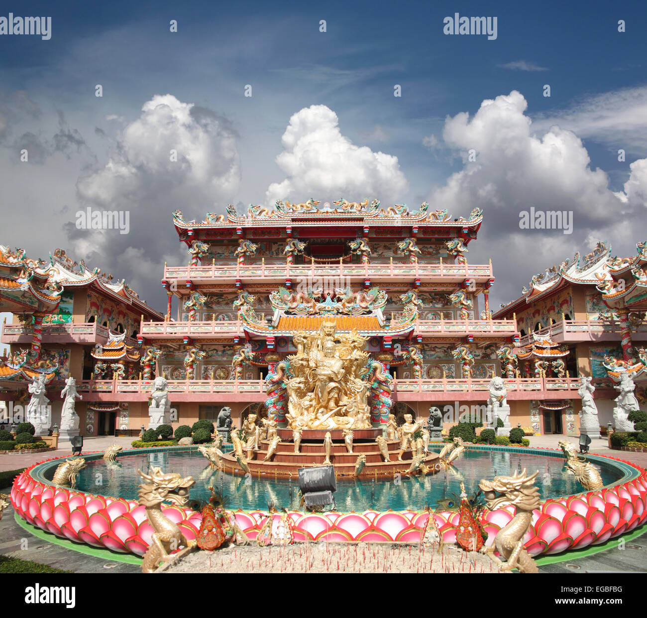 Sculpture in the Chinese Temple on blue sky and white cloud. Stock Photo