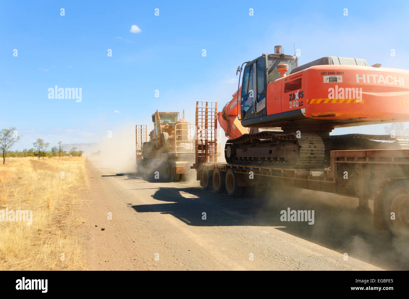 Hitachi Zaxis 240LC Excavator being transported on an Outback road, Kimberley Region, Western Australia, WA, Australia Stock Photo