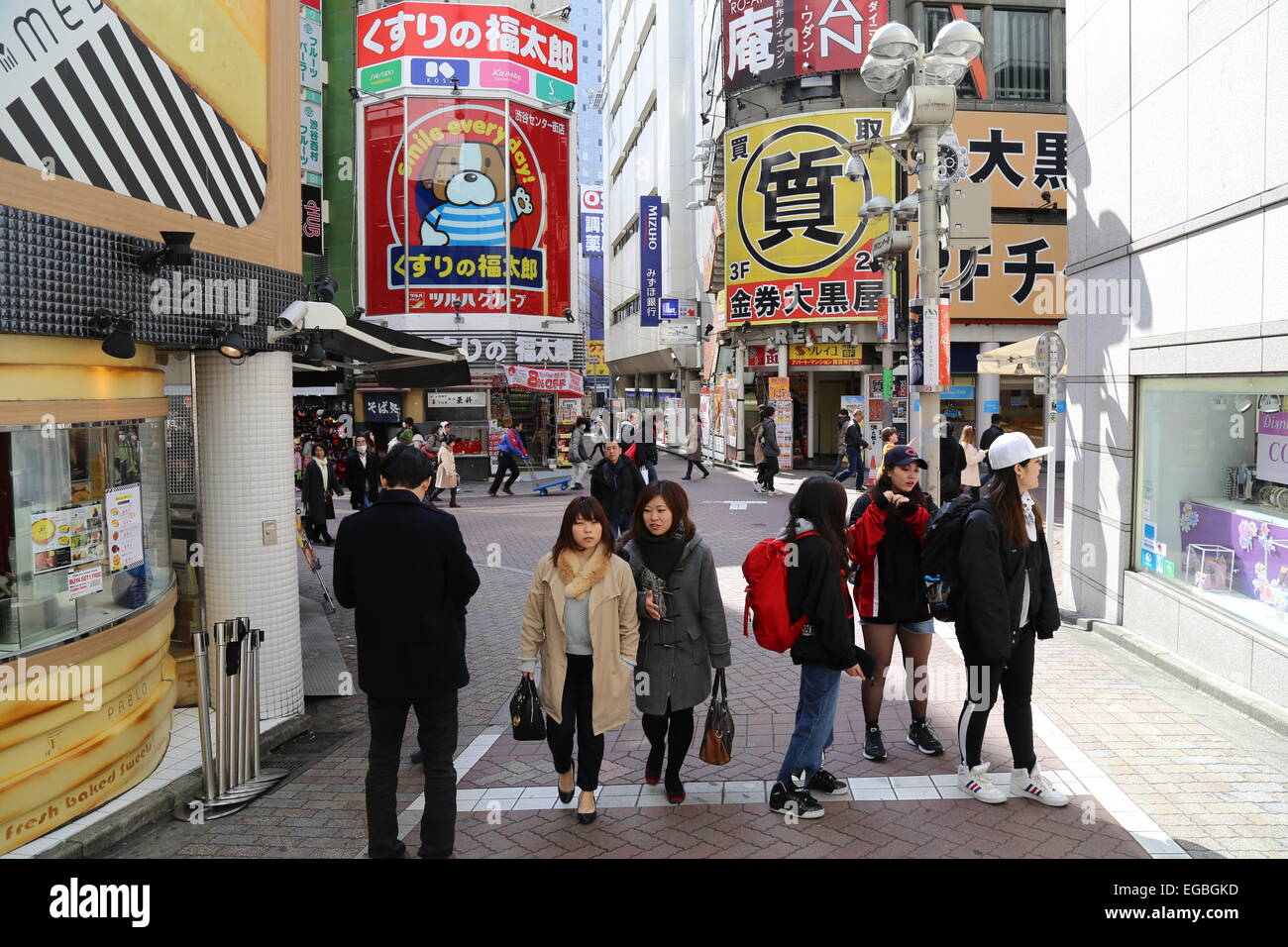 Japanese people walking and shopping in Shibuya, Japan. Stock Photo