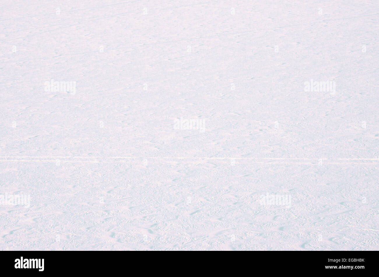 Snow cover with traces of snowmobile Stock Photo - Alamy