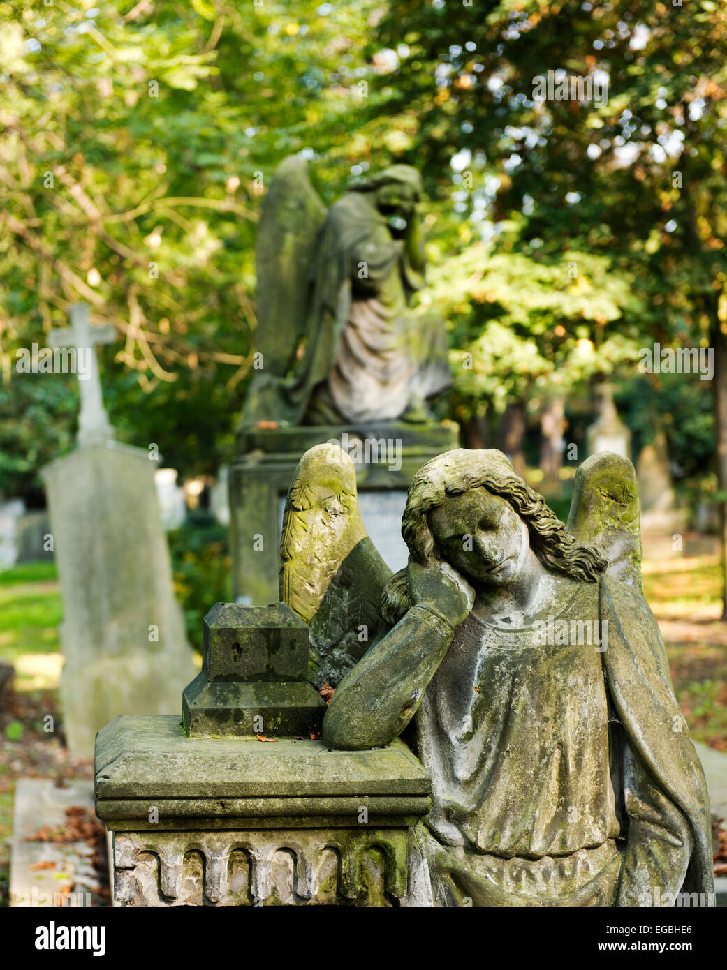 Angels guard grave sites in the Olsany Cemetery. Stock Photo