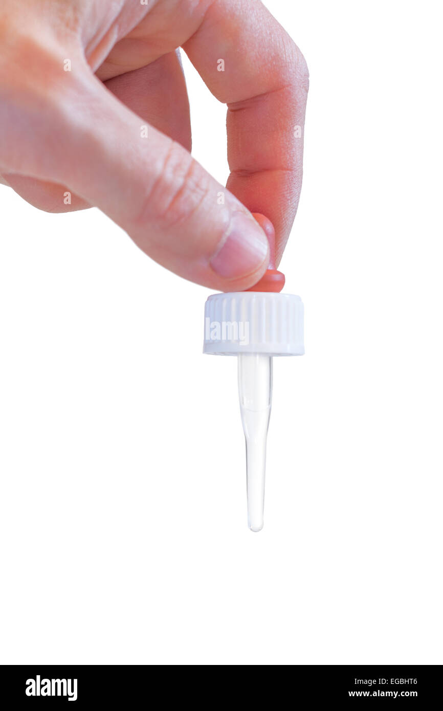 Hand holding a medicine pipette, isolated on white background Stock