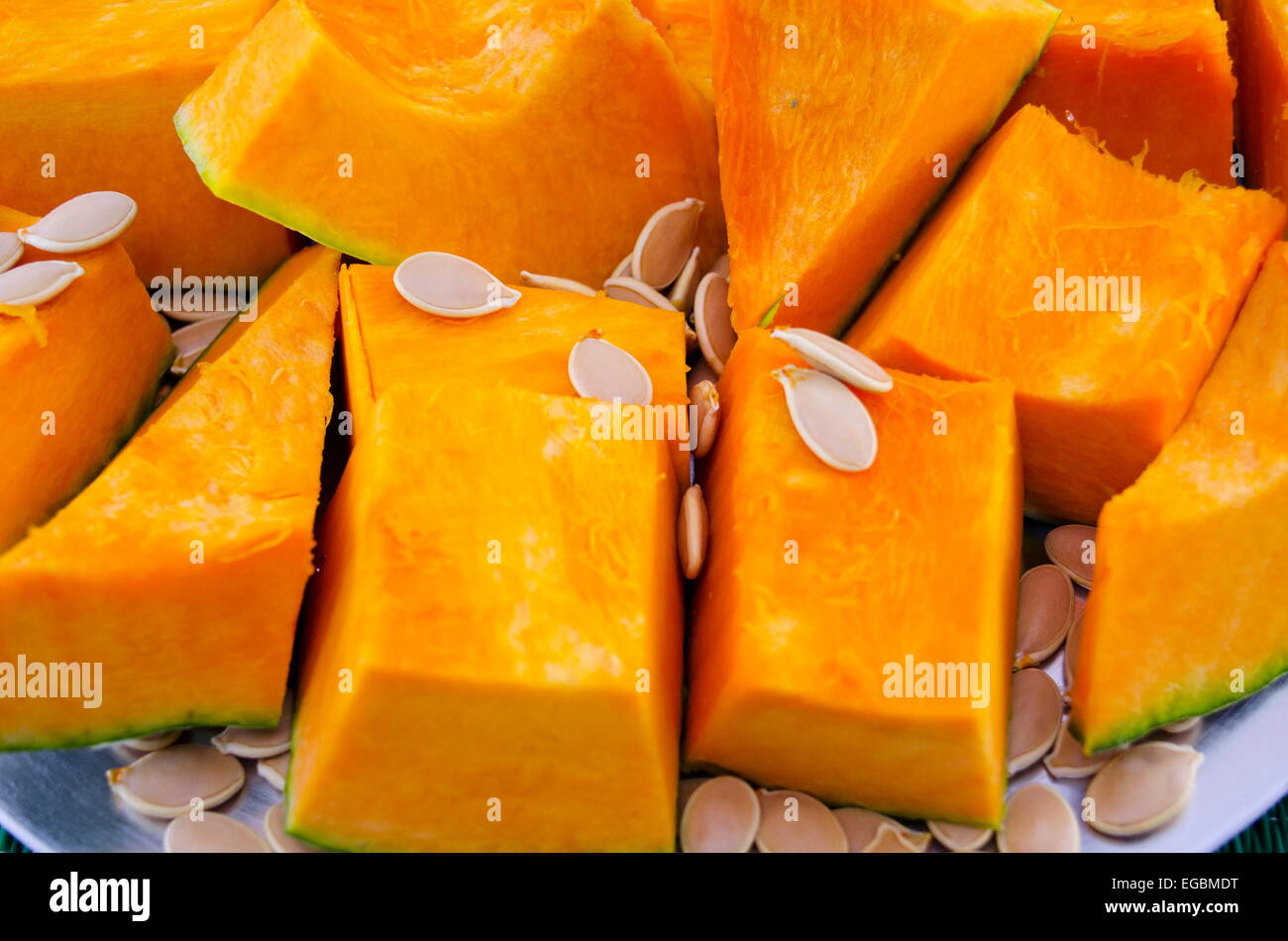 Fresh squash and seeds on a plate Stock Photo
