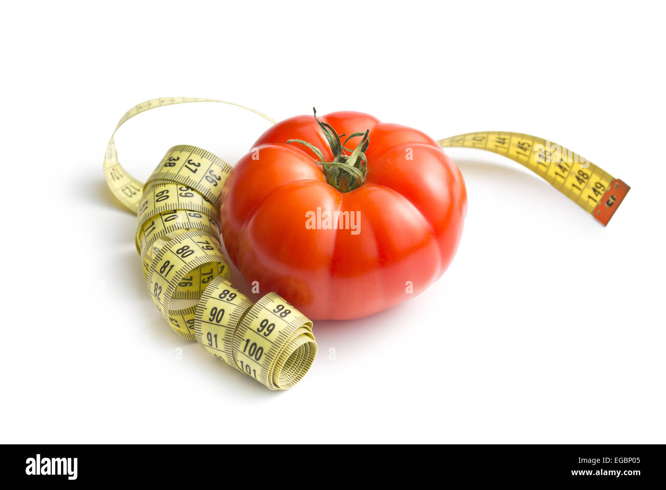 red tomato and measuring tape on white background Stock Photo