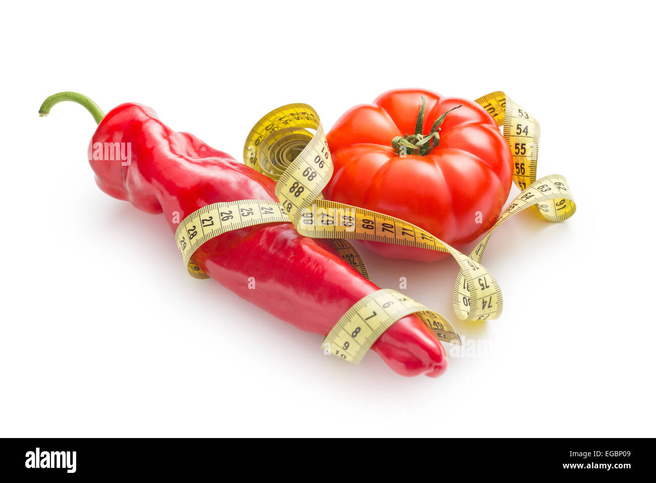 Diet concept. Pepper and tomato on white background. Stock Photo