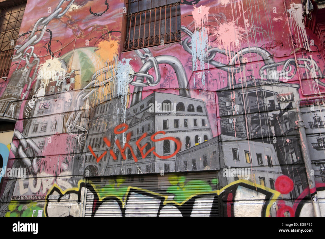 Building facade, with graffiti mural austerity and economic woe in Barcelona Spain Stock Photo