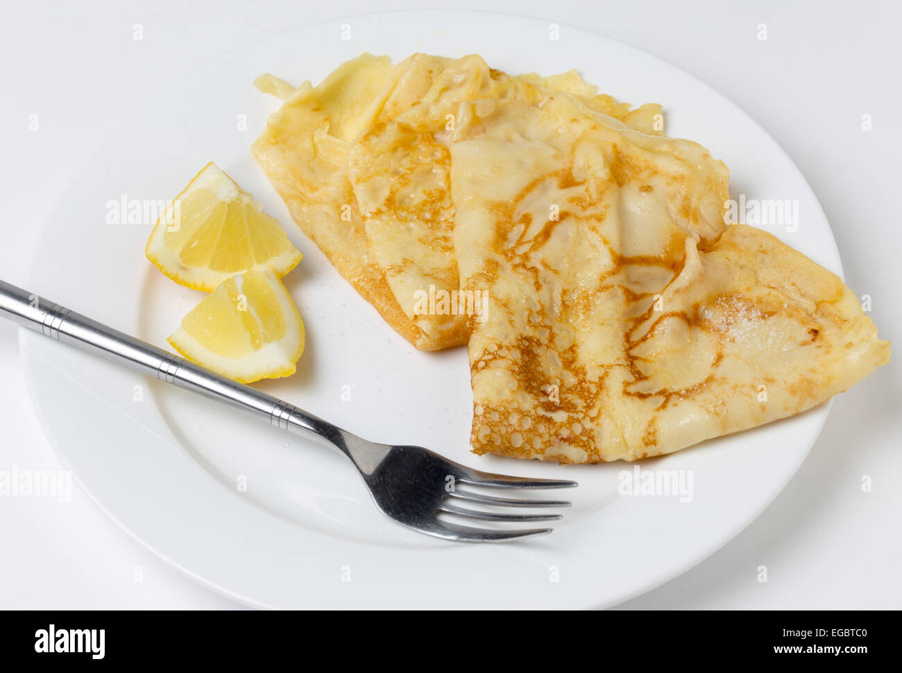 Pancakes English-style, with sugar and lemon, most traditionally served on Shrove Tuesday aka 'pancake day', Stock Photo