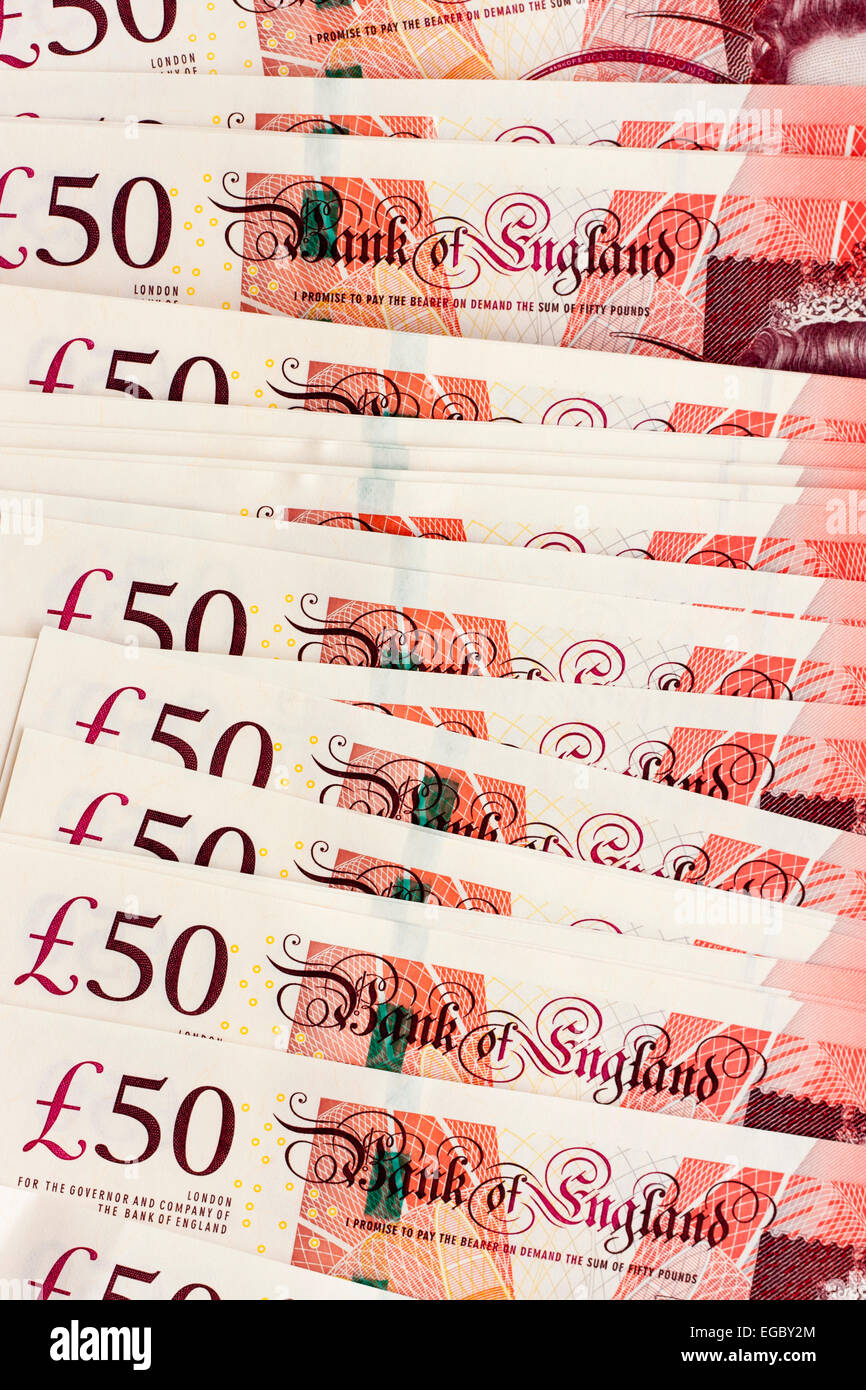 English £50 pound notes, arranged in overlapping pattern, showing £50