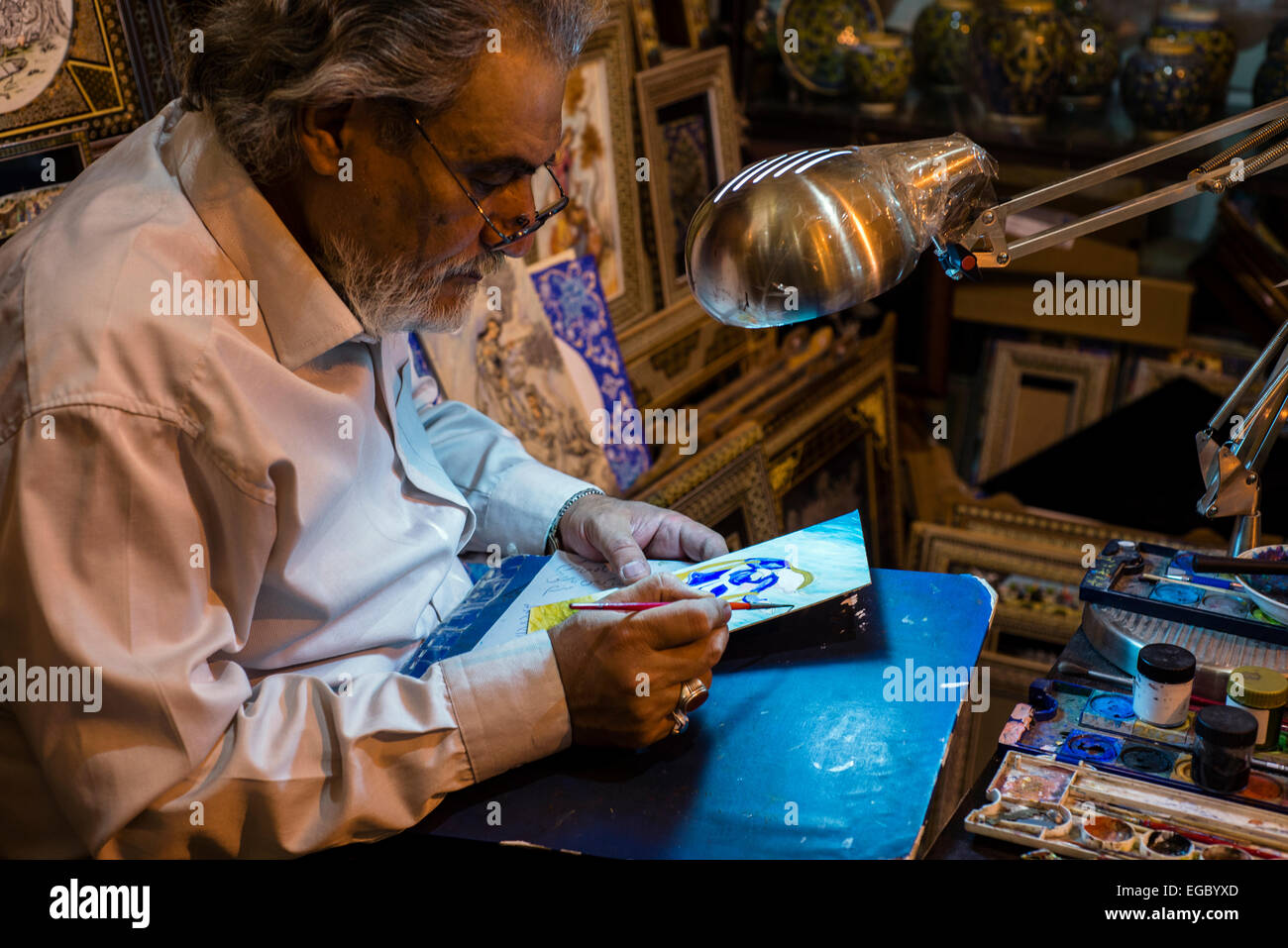 Painter-miniaturist Afarinesh Honar makes picture on camel bones, Esfahan, Iran Stock Photo