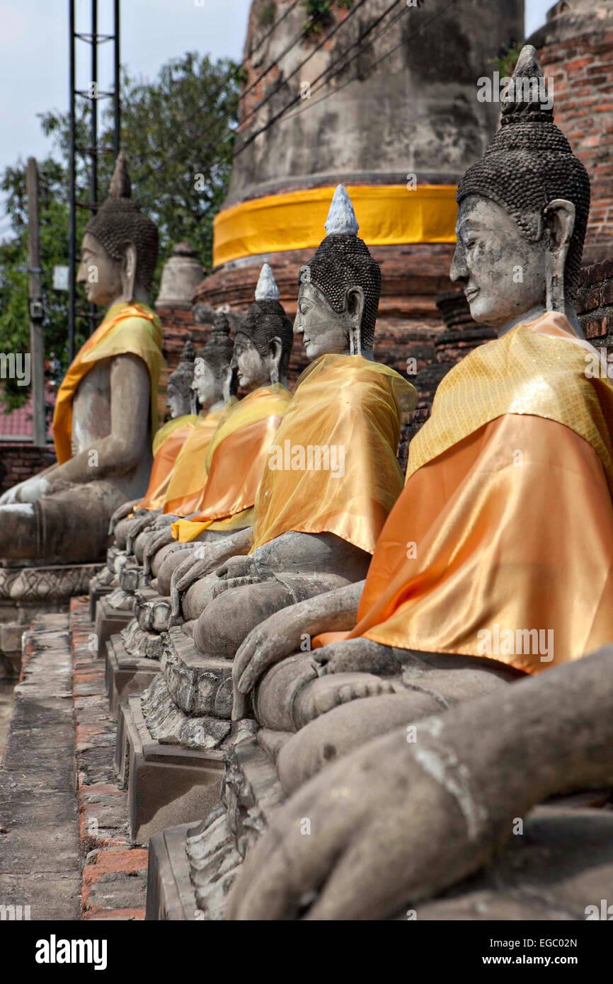 Buddhist statues decorated in robes at the Phra Nakhon Si Ayutthaya ruins February 15, 2015 in Ayutthaya, Thailand. Stock Photo