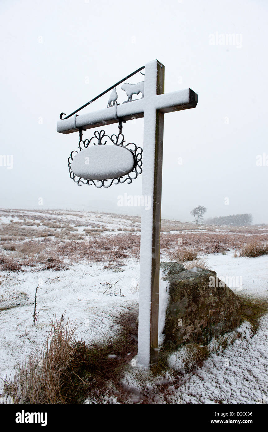 Mynydd Epynt, Powys, Wales, UK. 22nd february, 2015. UK Weather: A farm sign is blasted with snow by a blizzard on the high moorland of the Mynydd Epynt range of hills. Credit:  Graham M. Lawrence/Alamy Live News. Stock Photo