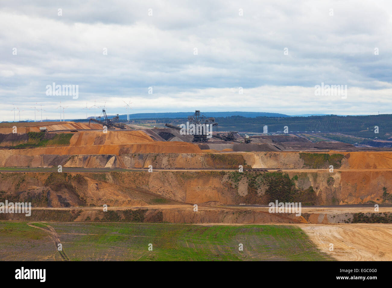 Bucket-wheel excavator in an open pit. landscape with extractive industry Stock Photo