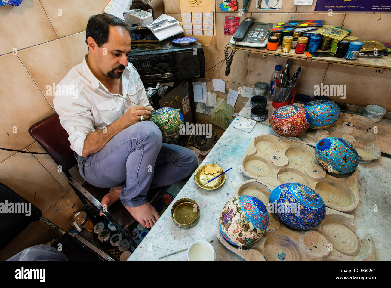 Artist Hassan Peykam paints ostrich's eggs, Esfahan, Iran Stock Photo
