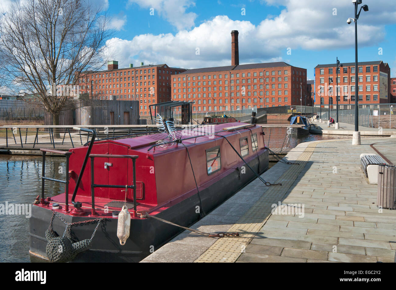 Canal barge in New Islington central Manchester,Ancoats Murray's Mills on the Rochdale canal in the background. Stock Photo